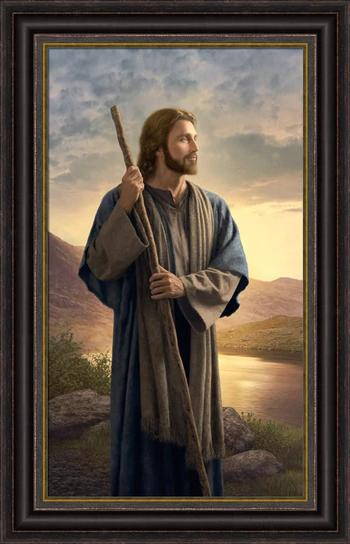Framed picture of esus standing next to a calm river.