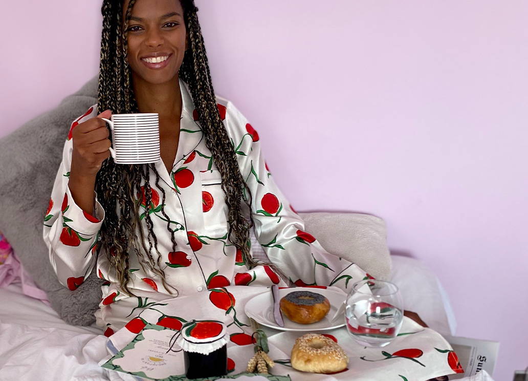 Noella Coursaris wears the Orange Print Classic Silk Pyjamas 