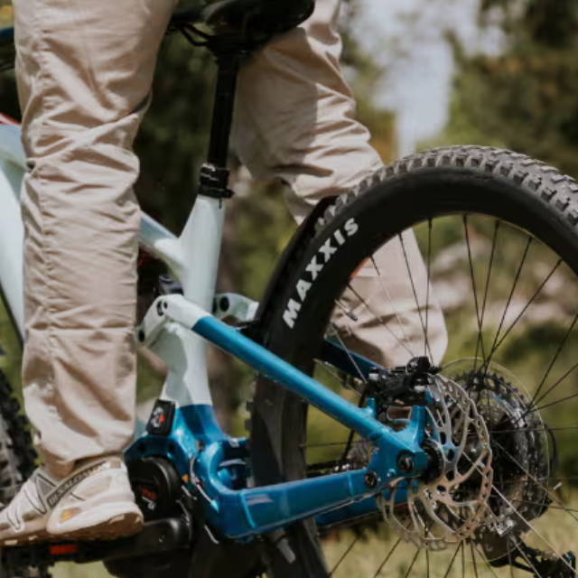 the rear wheel on a full suspension electric mountain bike