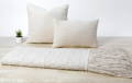 white throw and textured pillow