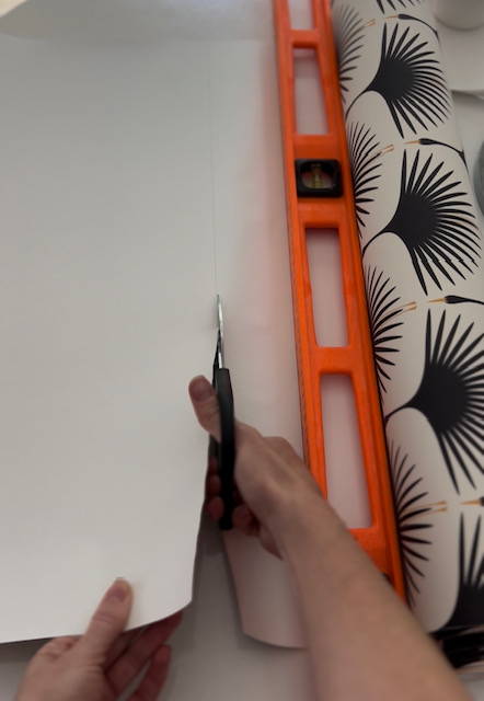 measuring and cutting wallpaper for drawer liner