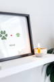 custom dog paw and dog nose art print in frame on shelf with candle