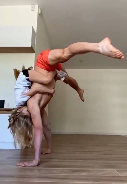 Doing Press Handstand With a Child on The Back