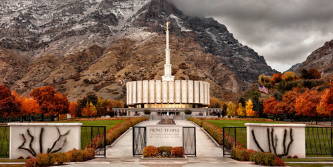 Provo Temple surrounded by autumn trees.