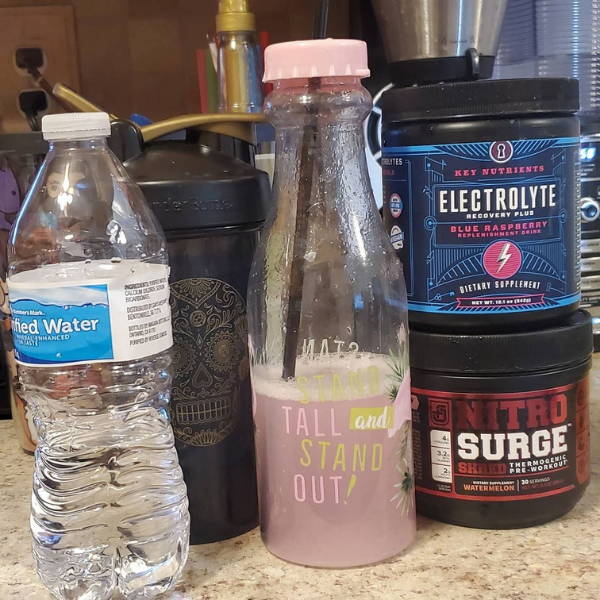 athlete shows his meal and jacked factory NITROSURGE pre workout