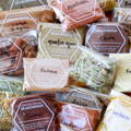 A pile of plastic spice pouches labeled with the spice name as well as 'Certified Organic'