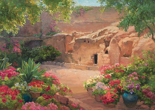Jesus' empty tomb surrounded by greenery and flowers.