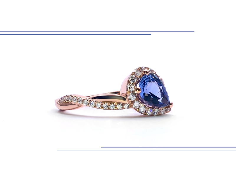 rose gold semi eternity ring with pear-shaped sapphire