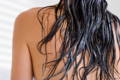 Back of woman with long rinsed hair