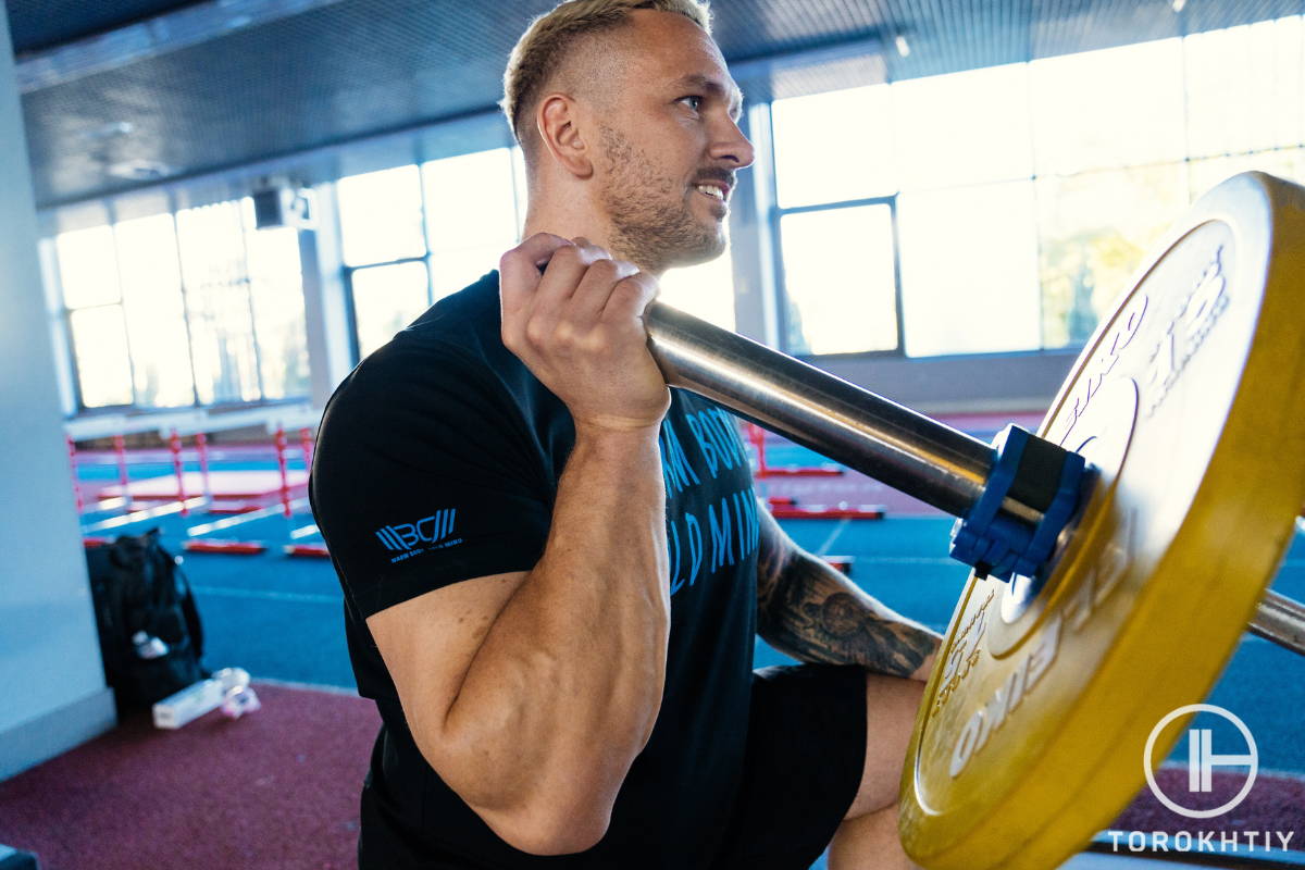 WBCM thrower performing exercises with bar