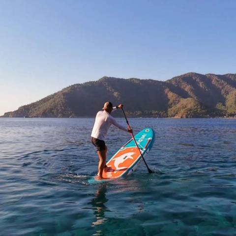Customer with her kid sitting in top rated blow up paddle boards