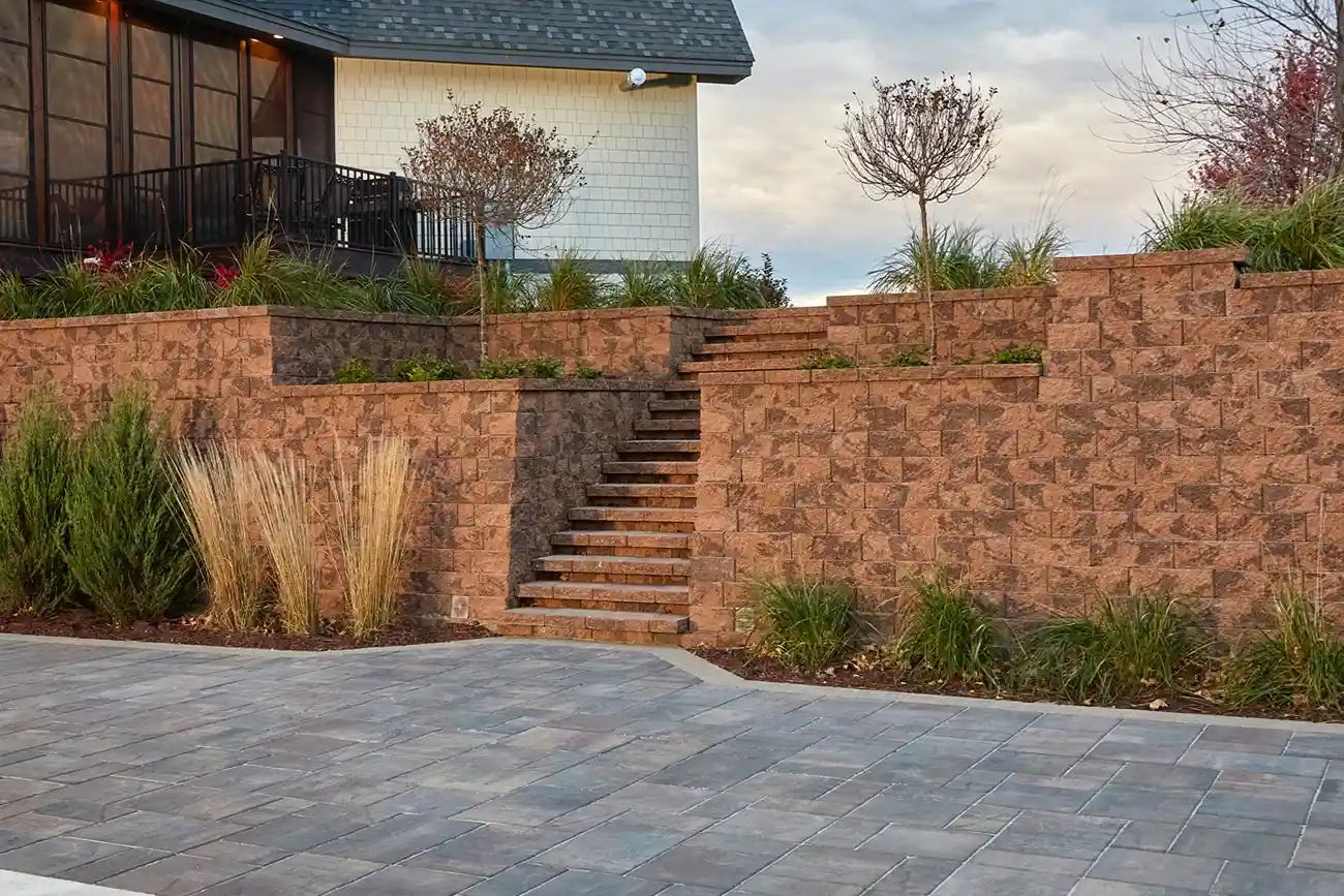 Retaining wall system made with Sterling Wall Blocks with a stair case.