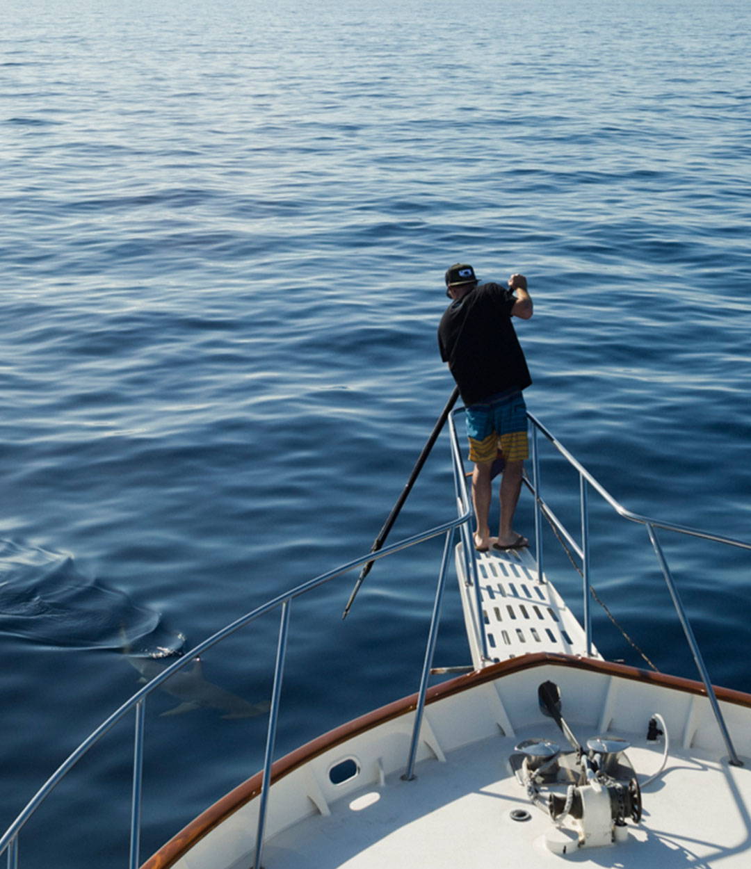 Owner Thos Carson on his boat getting ready to catch a swordfish. 