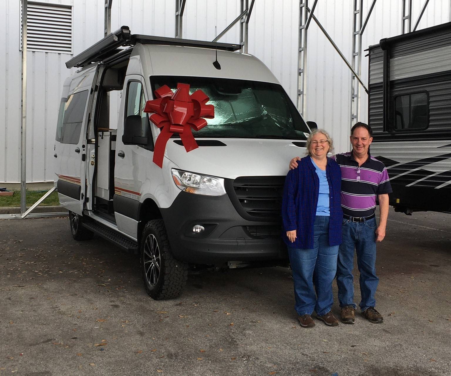 Tim and Jeanne Spellman picking up their brand new Storyteller Overland van