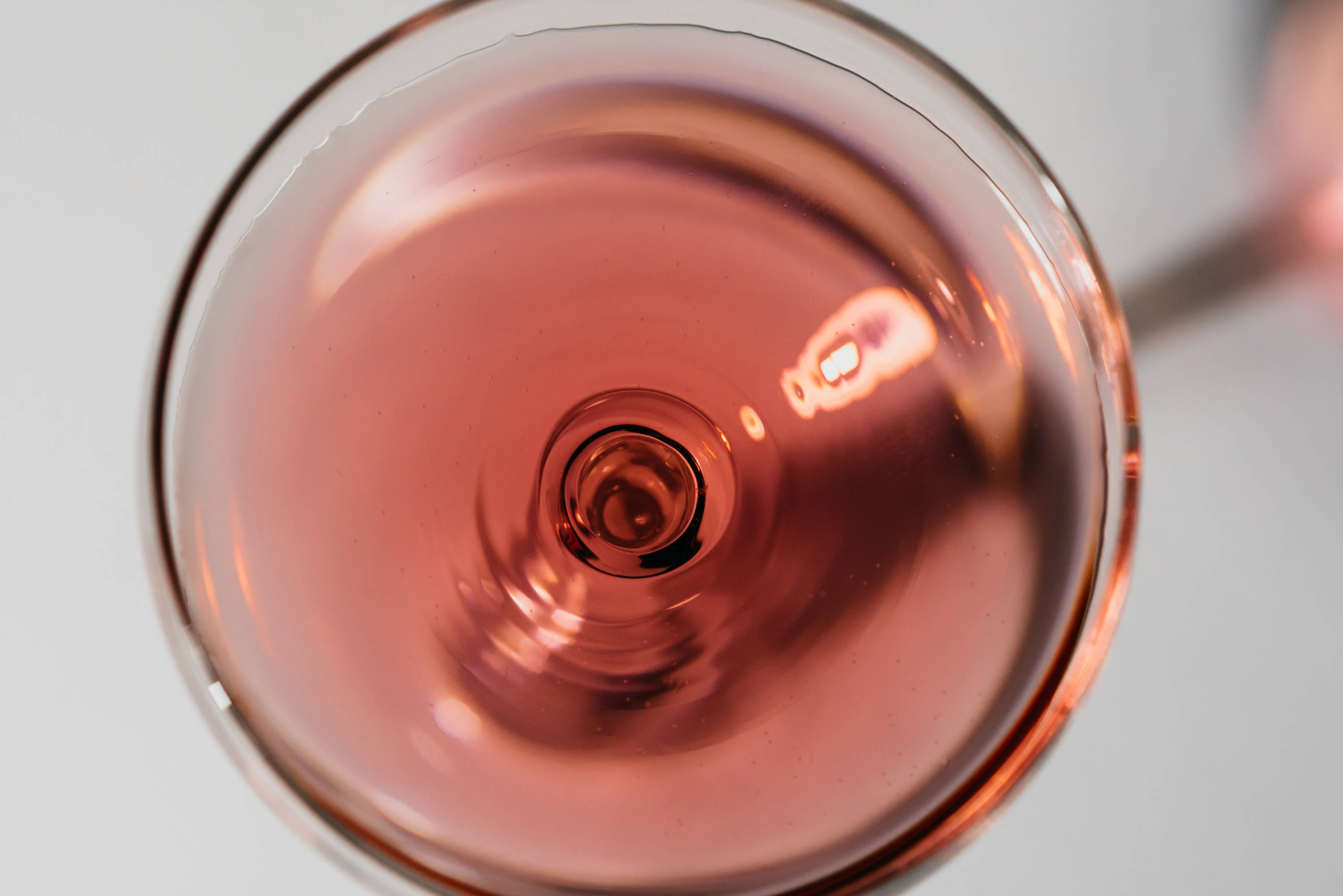 Top view inside rose glass staying true to its heritage; light red in colour and crisp.