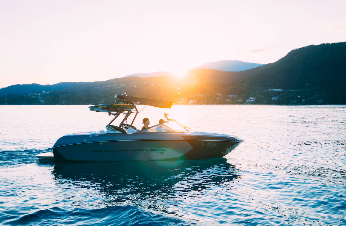 Boaters slow their motorboat down to an easy wake.