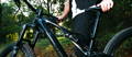 Rider with Specialized electric bike in forest trail