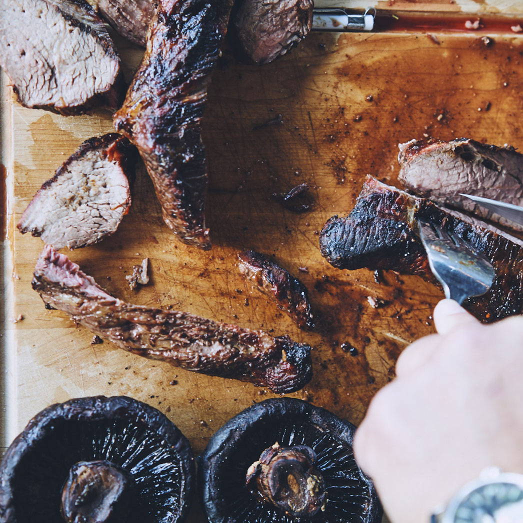 cutting up steak on Stick & Ball Steak Board