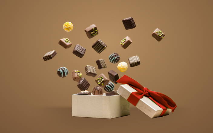 chocolates jumping out of a gift box for Confetti's Holiday Virtual Chocolate Tasting