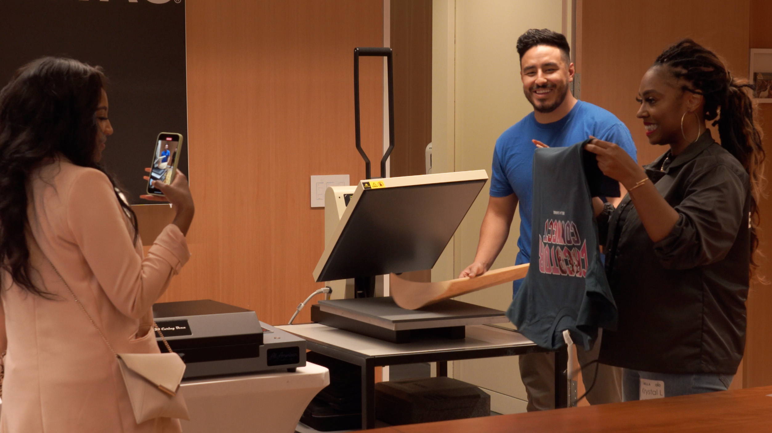 All American Print Supply Co's Vince Herrera demonstrating DTF printing process on the AA Prestige A3+ Desktop Printer at the BELLA+CANVAS Creator Connect 2022 event. 