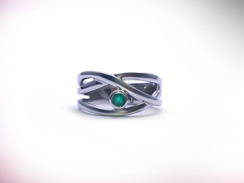 white gold cross ring with small emerald