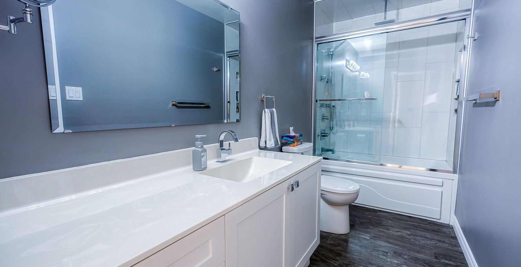 full bathroom with wood-type flooring, bath / shower combo with glass door, mirror, toilet, and vanity