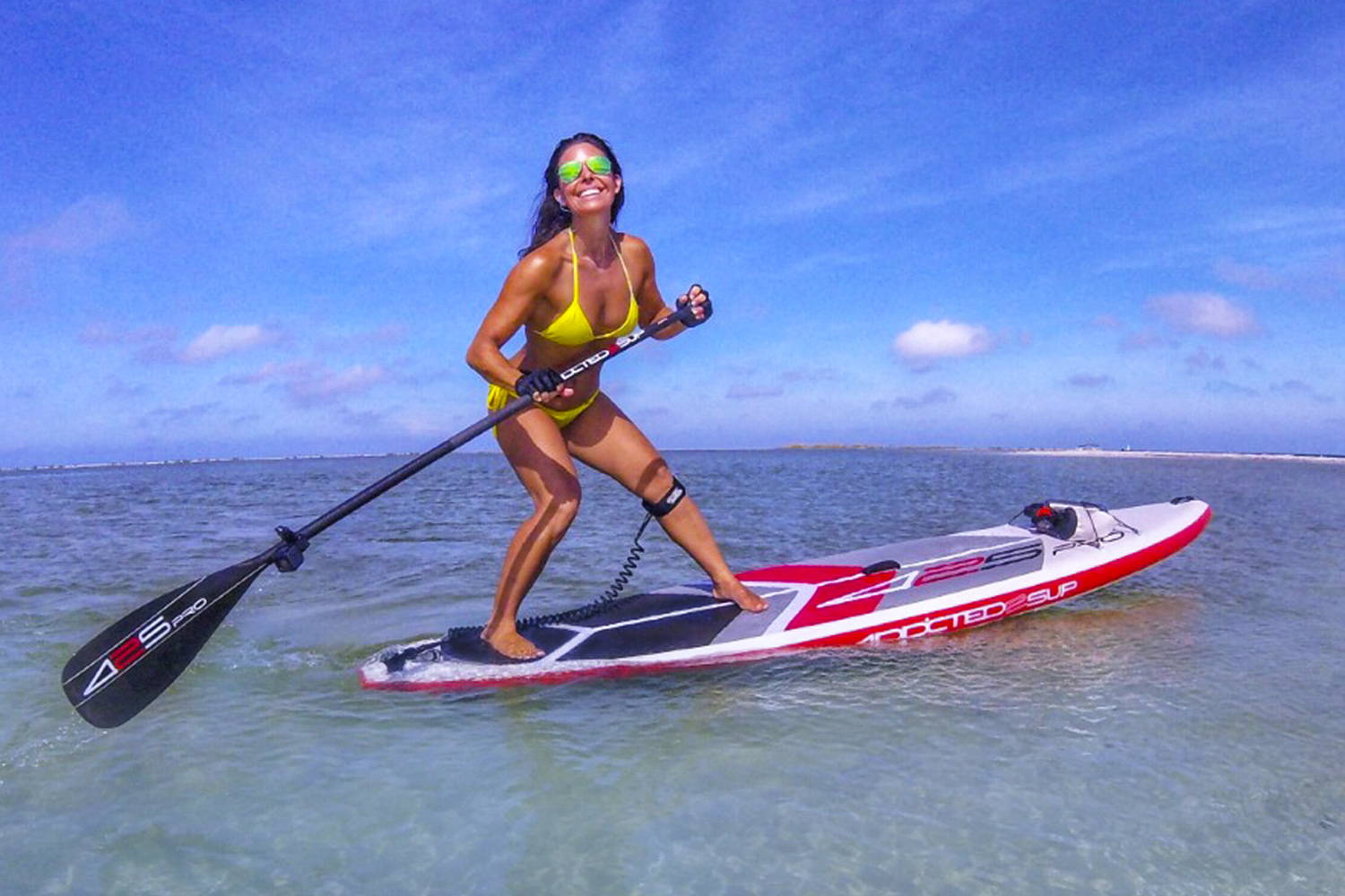 425 pro Air Sup Board: A woman on the board in the sea