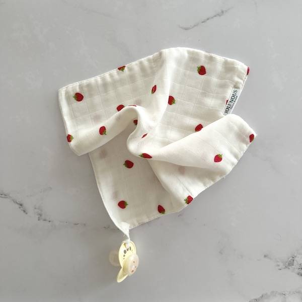 Lange XL et mini élégant de la marque suisse Joli Nous, un accessoire premium pour bébé, alliant design raffiné et qualité exceptionnelle
