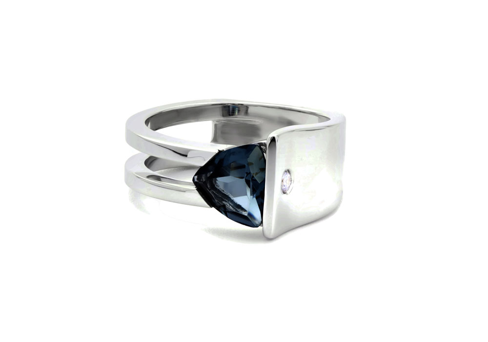 Bague au loook architectural en or blanc avec pierre trillion topaze london blue