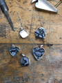 Black Couture Lace in Silver Hallmarked Pieces  on Wooden studio bench