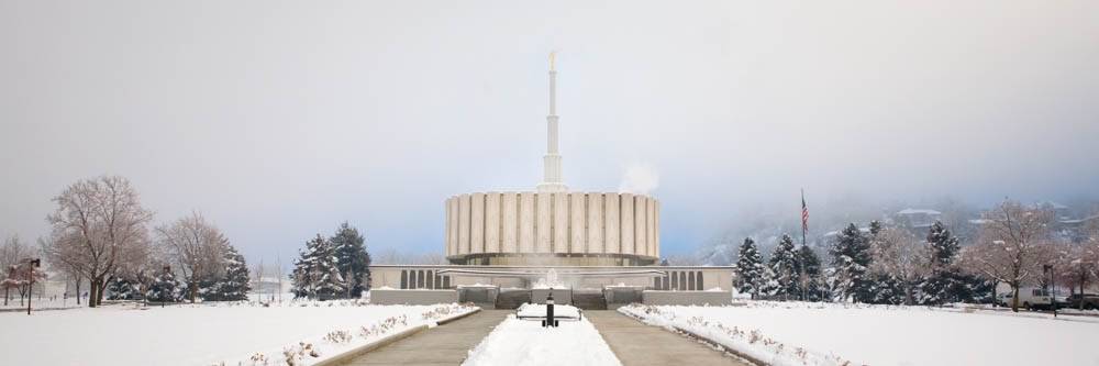 Panormaic picture of the Provo Temple. The grounds are covered in snow and fog. 