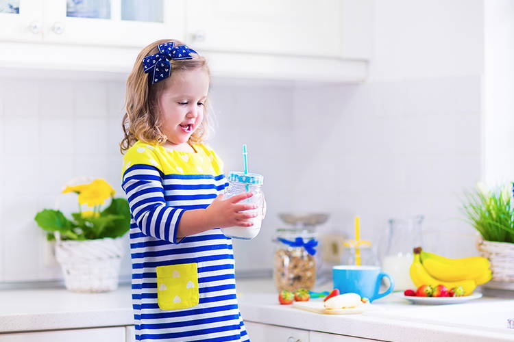 child enjoying milk with probiotics