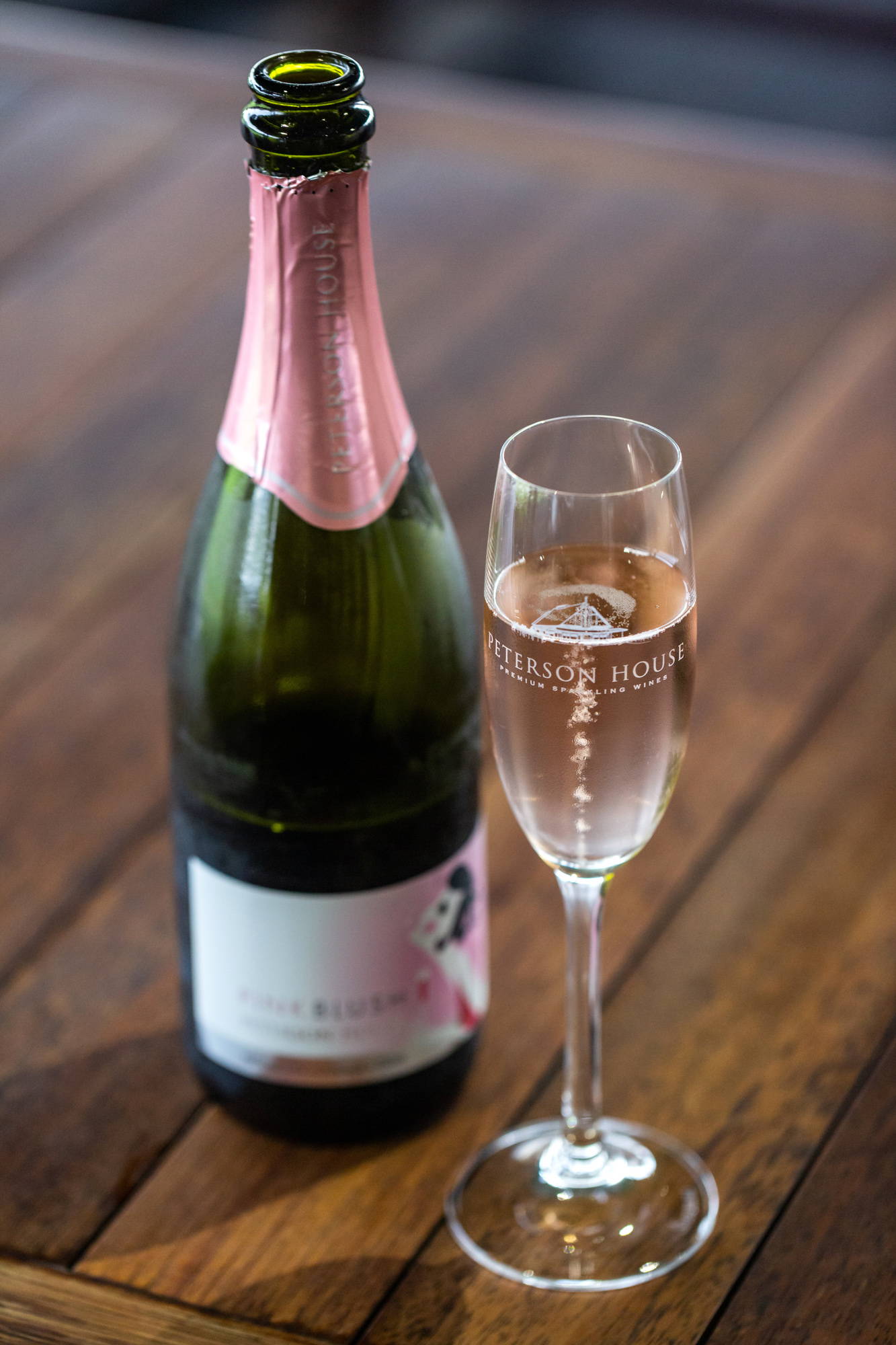 Cellar door staff pouring Champagne at Peterson House Cellar Door in Hunter Valley Winery