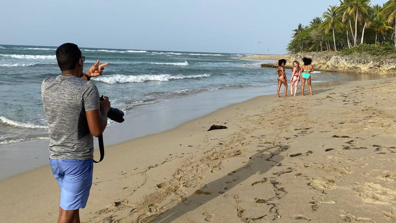 Bambina Swimwear photoshoot models and photographer on beach near ocean in bathing suits