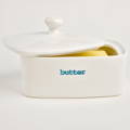 Keith Brymer Jones butter dish, lid slightly ajar with the word "Butter" on the front in blue writing