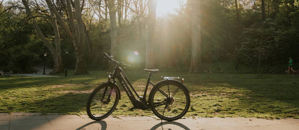 a Trek Allant electric city bike in a park