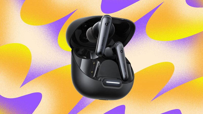Black in-ear headphones with long narrow tips, floating over an open case