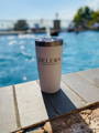 promotional product engraved custom logo tumbler by pool from happy customer testimonial working in real estate