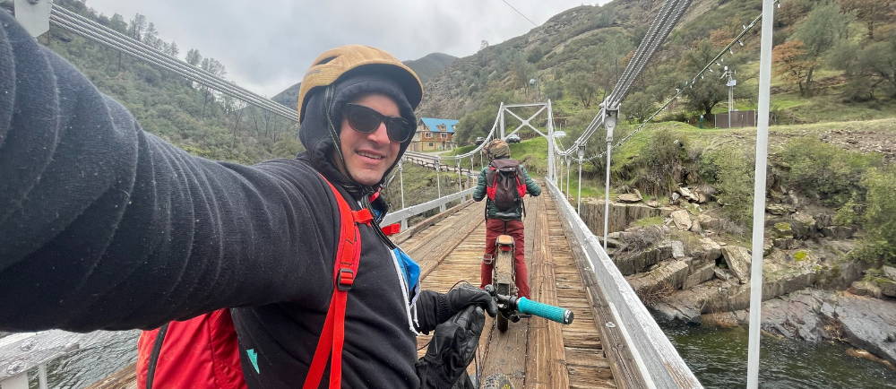 The author (left) and his friend Max crossing the suspension bridge at Briceburg during winter