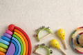 Colorful Montessori Rainbow and wooden rattles.
