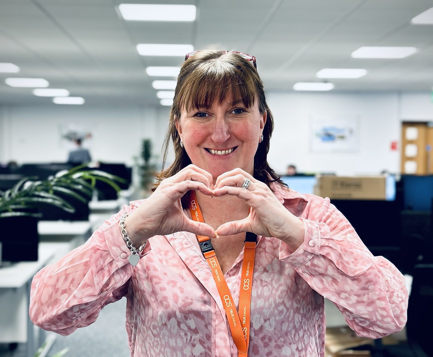 Woman making heart gesture for international women's day