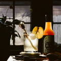 honey shrub cocktail in dark room