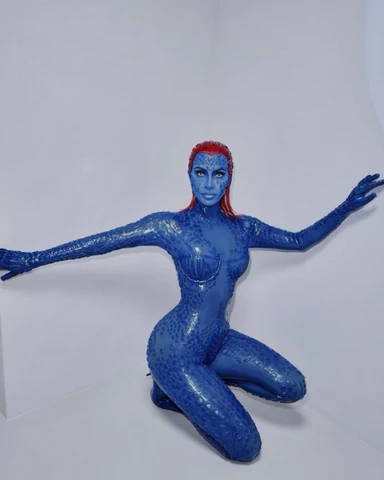 Kim Kardanshian in full-body blue latex Mystique costume with red hair, designed by Vex Clothing.