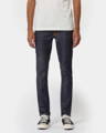 Man wearing dark wash organic cotton denim jeans from Swedish sustainable denim brand, Nudie Jeans