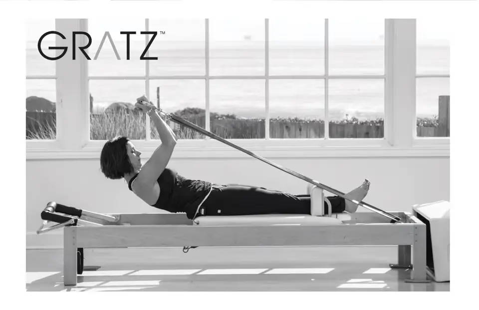 Image of Dana exercising on reformer