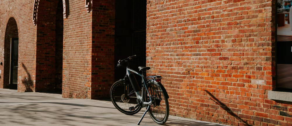 Gazelle electric bike in front of brick building