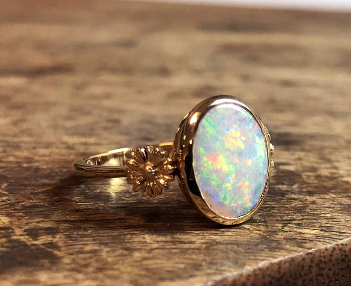 Opal on yellow gold flower ring