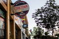 the corktown deli and love creamery street signs at dusk