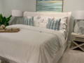 bedroom with white belgian linen slipcovered bed 