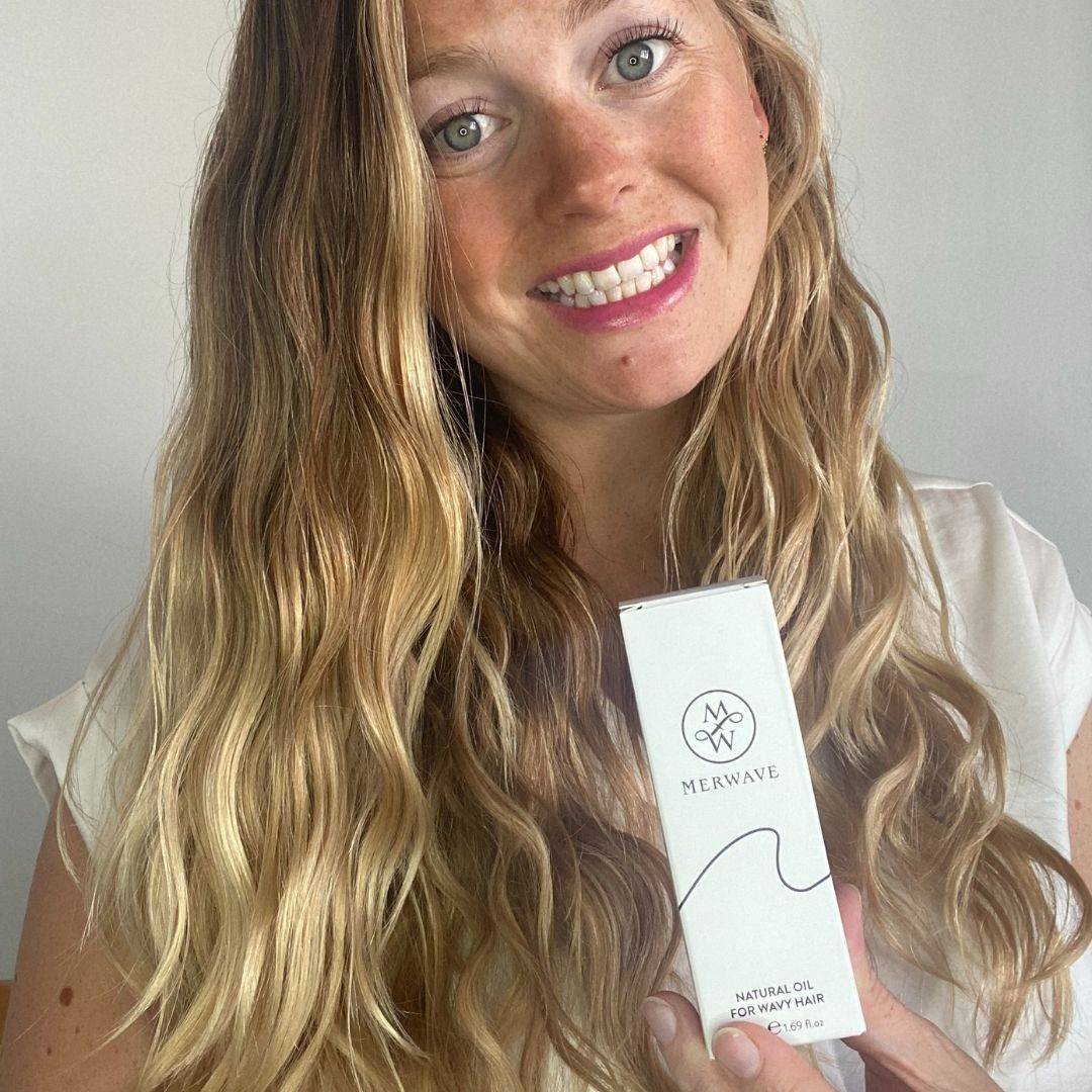 Photo of women holding wavy hair oil